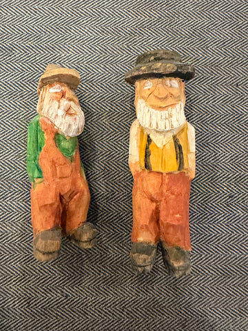 Pair of hand carved old men