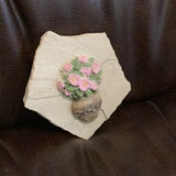 Hand cast concrete small Daisy on a rock wall tile