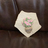 Hand cast concrete small Daisy on a rock wall tile