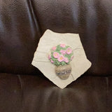Hand cast concrete small Daisy on a rock wall tile