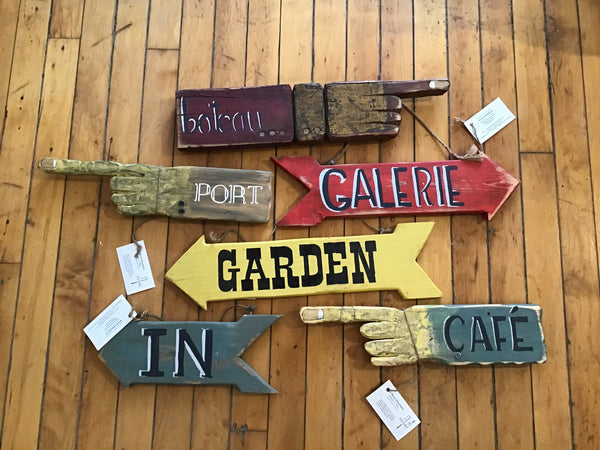 Short wooden pointing signs