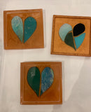 Coaster of glass mosaic hearts and leaves in resin by Mary Jane Jarvis